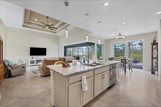 12194 Everglades Ave, Port Charlotte, FL 33981 - kitchen with stainless steel dishwasher, a sink, light stone countertops, a ceiling fan, and pendant lighting