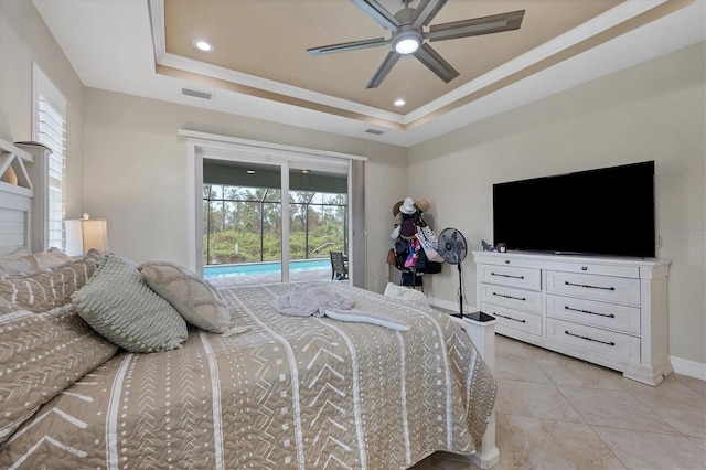 bedroom featuring access to exterior, light tile patterned floors, ceiling fan, crown molding, and a tray ceiling