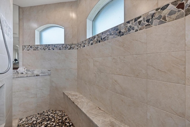 bathroom featuring tiled shower