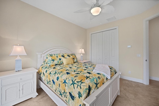 tiled bedroom featuring a closet and ceiling fan