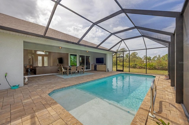 view of pool featuring a patio area and a lanai