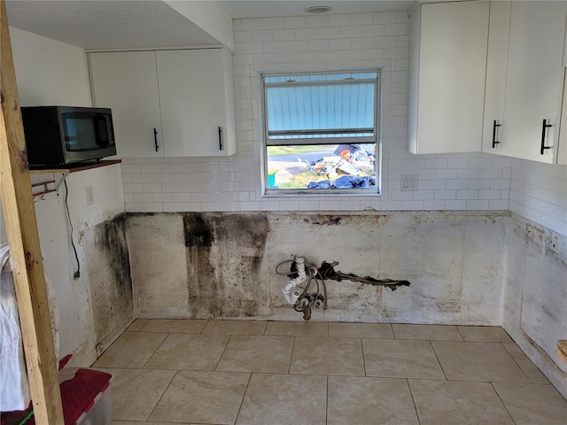 kitchen with white cabinets