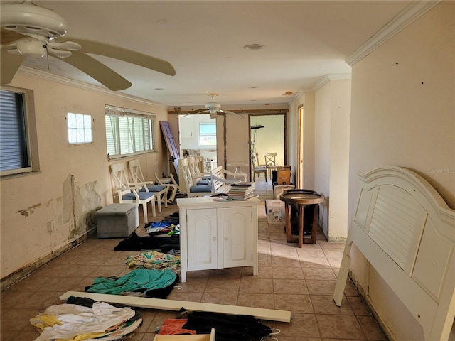 misc room featuring light tile patterned floors and ornamental molding