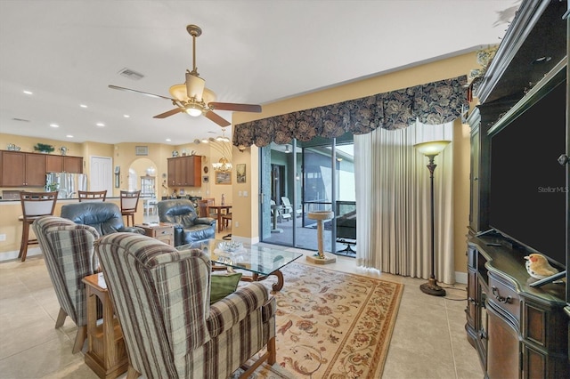 tiled living room with ceiling fan