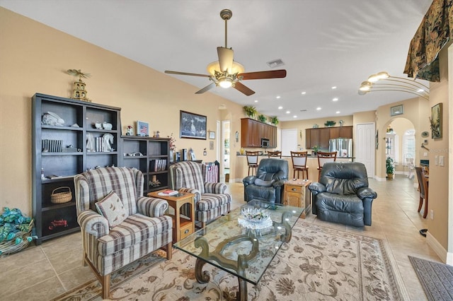 living room with ceiling fan and light tile patterned floors