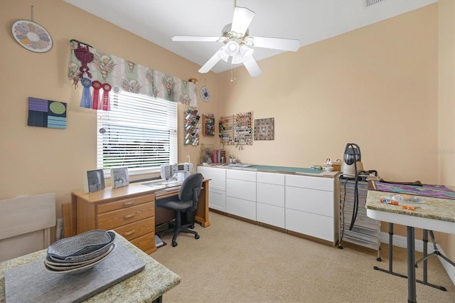 office space with light carpet and ceiling fan