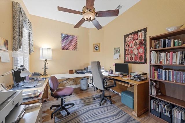 office featuring light wood-type flooring and ceiling fan