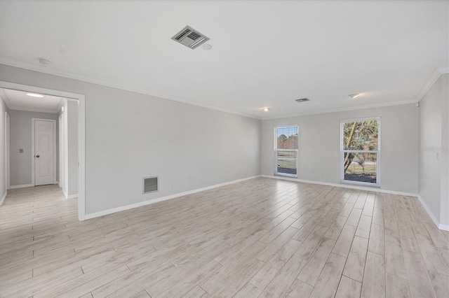 unfurnished room with ornamental molding and light hardwood / wood-style floors