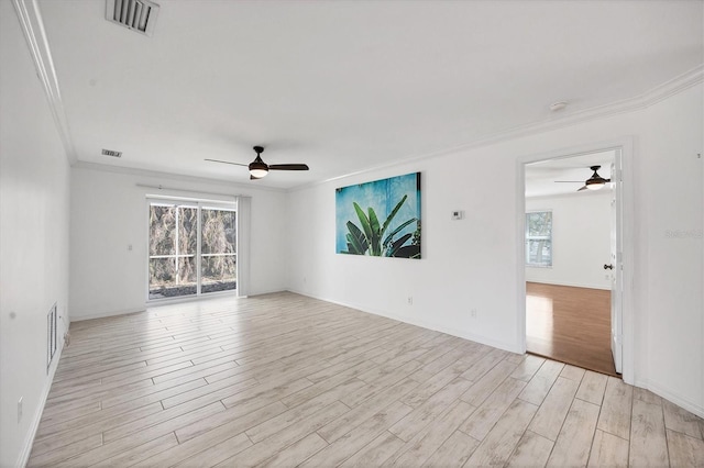 spare room with ceiling fan, ornamental molding, and light wood-type flooring