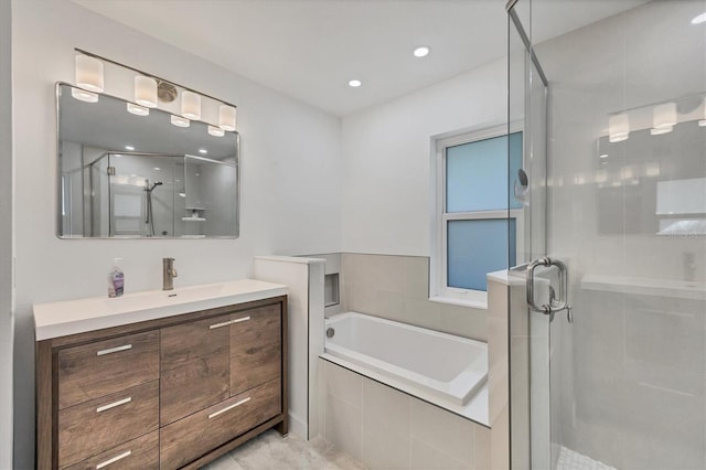 bathroom featuring vanity, independent shower and bath, and tile patterned flooring