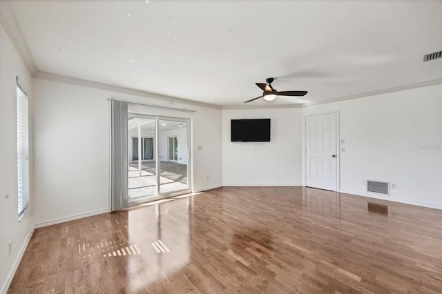 spare room featuring hardwood / wood-style flooring, ceiling fan, and ornamental molding