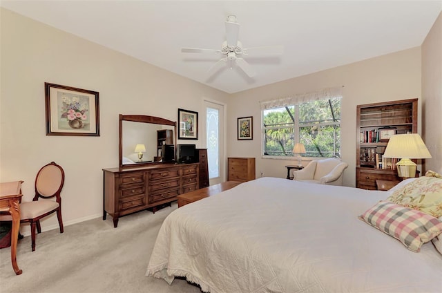 bedroom featuring light colored carpet and ceiling fan