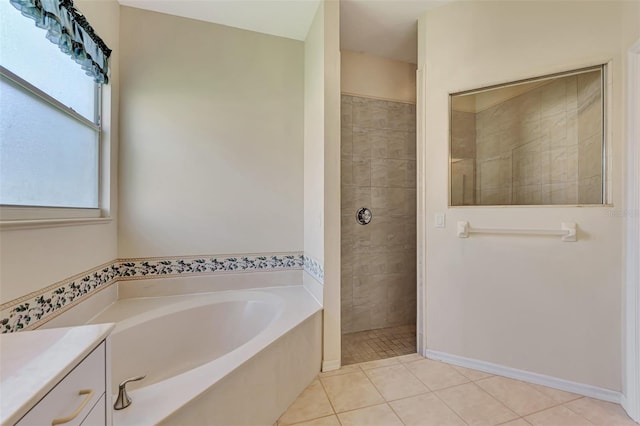 bathroom with shower with separate bathtub, tile patterned floors, and vanity