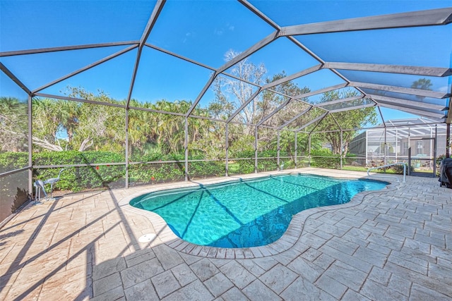 view of pool featuring a lanai and a patio area