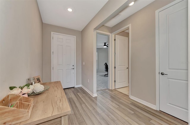 entryway with light hardwood / wood-style flooring and ceiling fan