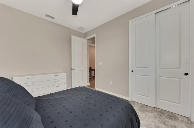 bedroom with carpet floors, ceiling fan, and a closet