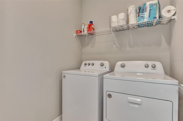 washroom featuring independent washer and dryer