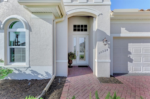 property entrance with a garage