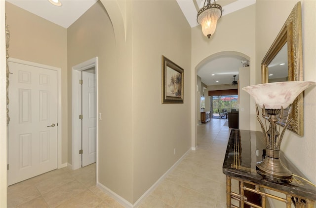 hall featuring light tile patterned floors