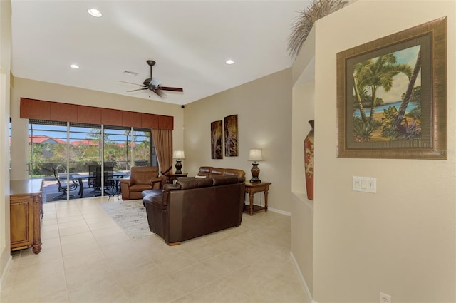 living room featuring light tile patterned flooring and ceiling fan