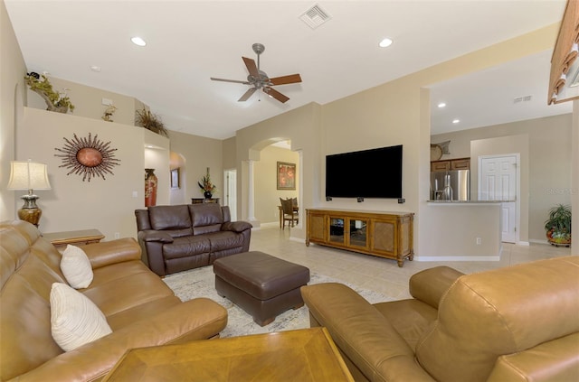 tiled living room with ceiling fan