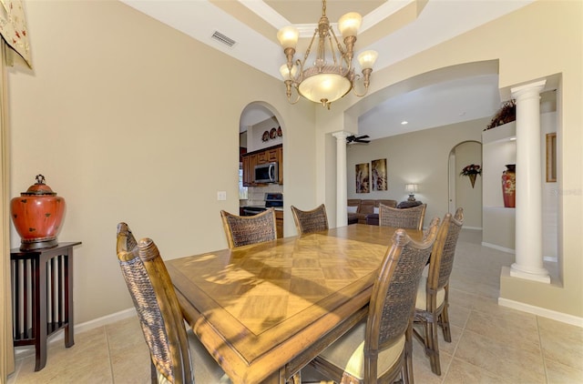 dining area featuring light tile patterned floors, decorative columns, and an inviting chandelier