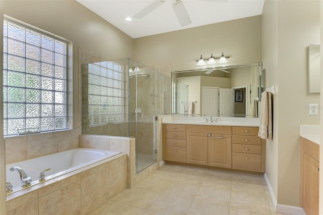 bathroom with ceiling fan, tile patterned flooring, vanity, and shower with separate bathtub