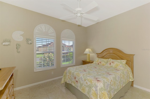 bedroom featuring light tile patterned floors and ceiling fan