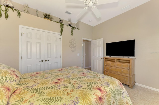 tiled bedroom with a closet and ceiling fan