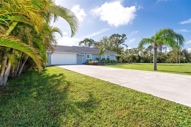 5214 Norlander Dr, Port Charlotte, FL 33981 - ranch-style home with concrete driveway, an attached garage, and a front yard