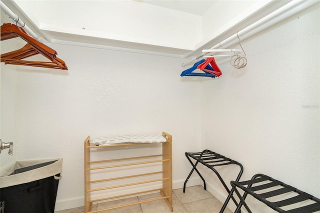 walk in closet with tile patterned floors