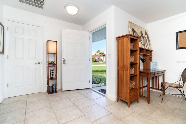 entrance foyer featuring light tile patterned floors