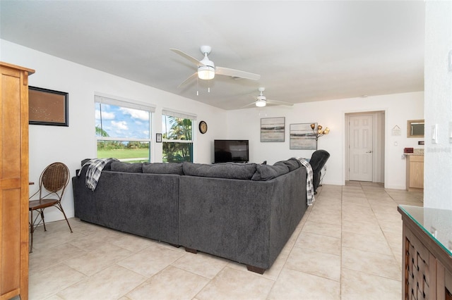 living room with ceiling fan and light tile patterned flooring