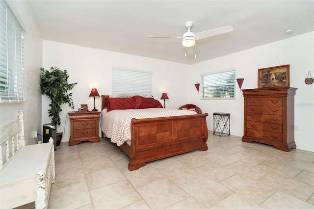 bedroom featuring ceiling fan and light tile patterned floors