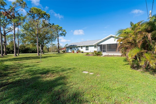 view of yard with a sunroom