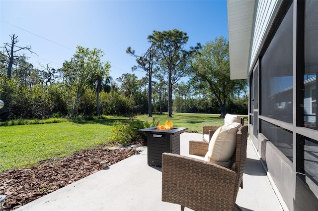 view of patio with a fire pit