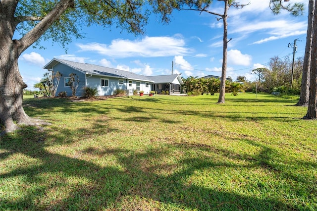 view of yard featuring a sunroom