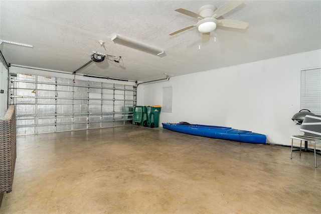 garage featuring ceiling fan and a garage door opener