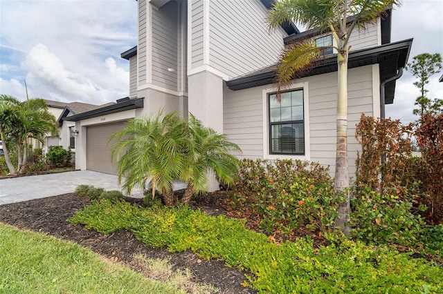 view of property exterior with a garage