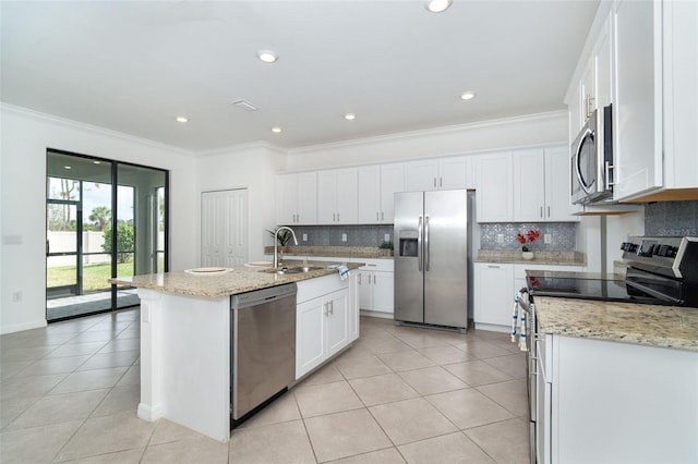 19524 Fishhawk Trl, Venice, FL 34293 - kitchen featuring appliances with stainless steel finishes, light tile patterned floors, backsplash, a sink, and crown molding