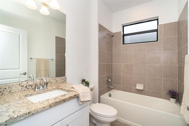 full bathroom with vanity, toilet, and tiled shower / bath combo