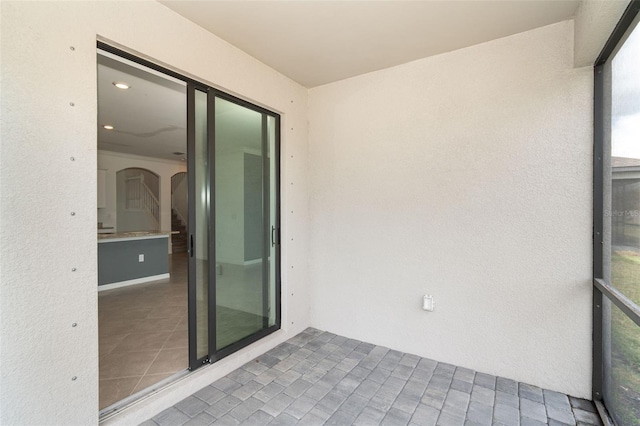 19524 Fishhawk Trl, Venice, FL 34293 - unfurnished sunroom with arched walkways