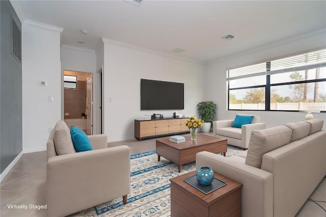 living area featuring visible vents, baseboards, ornamental molding, and light tile patterned flooring