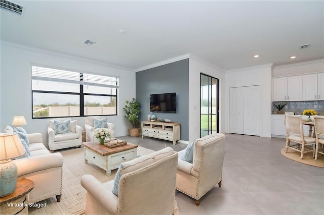 living room with visible vents and plenty of natural light