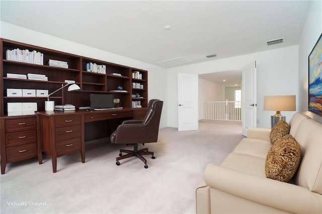 home office featuring visible vents and light colored carpet