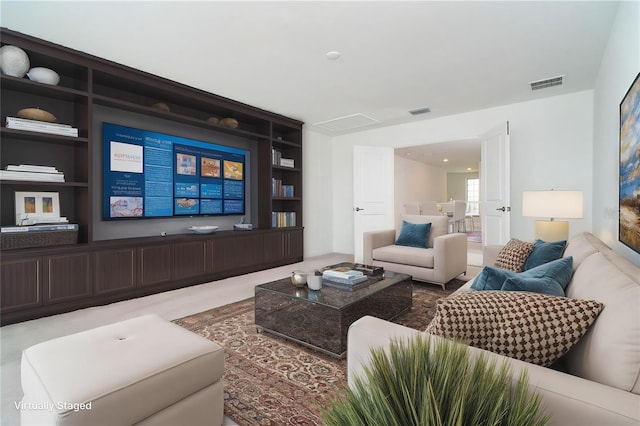 living area featuring visible vents and built in features