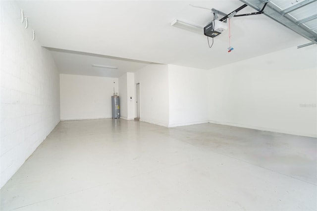 garage with water heater, concrete block wall, and a garage door opener