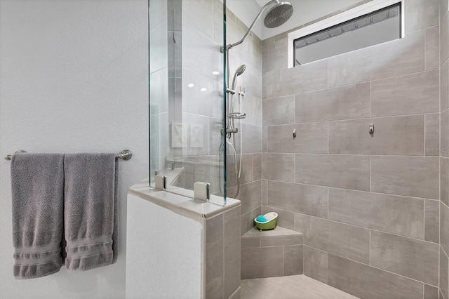 bathroom with tiled shower