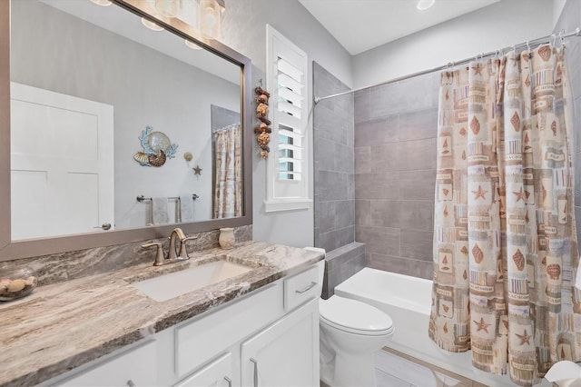 full bathroom with vanity, toilet, and shower / tub combo