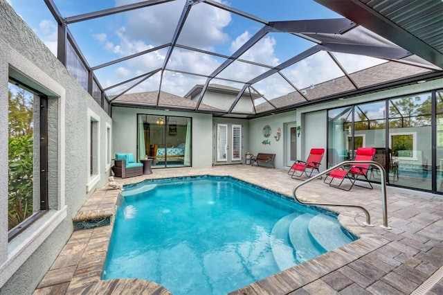 view of pool featuring a patio area, a lanai, and pool water feature